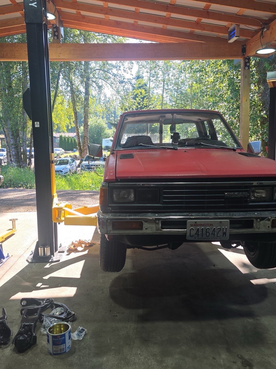 A classic pickup under the covered service bay