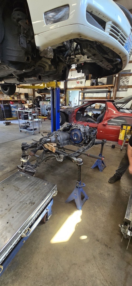 Drivetrain work underway on a truck up on the lift
