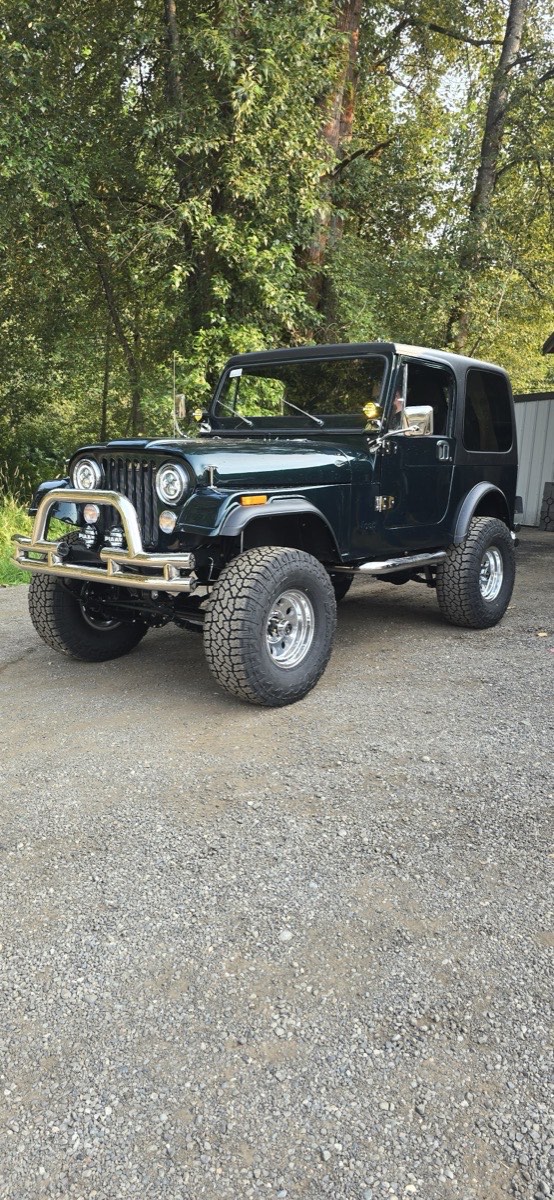 A built Jeep CJ outside the shop, trail ready